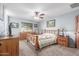 Serene bedroom with a wooden bed frame and ample closet space at 2618 W Surrey Ave, Phoenix, AZ 85029