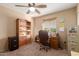 Home office or bedroom with built-in shelving at 2618 W Surrey Ave, Phoenix, AZ 85029