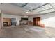 Spacious garage with shelving, workbench, and ample storage space at 2618 W Surrey Ave, Phoenix, AZ 85029