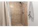 Clean shower with tile surround at 2618 W Surrey Ave, Phoenix, AZ 85029