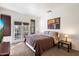 Bright bedroom with double doors leading to a balcony at 2757 S Pewter Dr # 103, Gilbert, AZ 85295