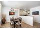 Bright dining area with dark wood table and six chairs at 2757 S Pewter Dr # 103, Gilbert, AZ 85295