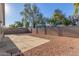 Spacious backyard with gravel, concrete patio and block wall at 2818 N 90Th Ave, Phoenix, AZ 85037