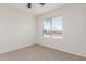 Well-lit bedroom featuring carpeted floor and window blinds at 2818 N 90Th Ave, Phoenix, AZ 85037