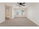 Spacious bedroom with ceiling fan and carpeting at 2818 N 90Th Ave, Phoenix, AZ 85037