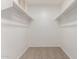 Spacious walk-in closet with double rods and shelving at 2818 N 90Th Ave, Phoenix, AZ 85037