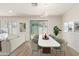 Dining area with modern table and chairs, near sliding door at 2818 N 90Th Ave, Phoenix, AZ 85037