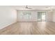 Bright living room featuring light flooring and sliding glass door to backyard at 2818 N 90Th Ave, Phoenix, AZ 85037