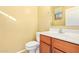 Clean bathroom with wood vanity and updated fixtures at 2875 S Key Biscayne Dr, Gilbert, AZ 85295