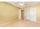 Well-lit bedroom with sliding door closet and wood-look floors at 2875 S Key Biscayne Dr, Gilbert, AZ 85295