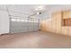 Garage with storage cabinets and epoxy flooring at 2875 S Key Biscayne Dr, Gilbert, AZ 85295