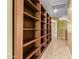 Hallway with built-in shelving and wood flooring at 2875 S Key Biscayne Dr, Gilbert, AZ 85295