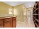 Hallway with wood flooring and built-in storage at 2875 S Key Biscayne Dr, Gilbert, AZ 85295