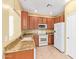 Kitchen with granite countertops and wood cabinets at 2875 S Key Biscayne Dr, Gilbert, AZ 85295