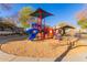 Modern playground with colorful play structures and shaded seating at 2875 S Key Biscayne Dr, Gilbert, AZ 85295