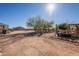 Landscaped backyard with rock accents and mature trees at 28821 N Ashbrook Ln, Queen Creek, AZ 85144