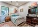 Bedroom with a comfy bed, dresser, and decorative accents at 28821 N Ashbrook Ln, Queen Creek, AZ 85144