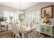 Charming dining room with large windows and wood floors at 28821 N Ashbrook Ln, Queen Creek, AZ 85144