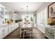 Bright dining room with white cabinets and wood floors at 28821 N Ashbrook Ln, Queen Creek, AZ 85144