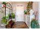 Bright entryway with wood flooring, plants, and decorative furniture at 28821 N Ashbrook Ln, Queen Creek, AZ 85144