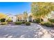 Single-story home with paved driveway, landscaping, and a covered entryway at 28821 N Ashbrook Ln, Queen Creek, AZ 85144