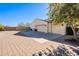 Two-car garage with paved driveway and gated entry at 28821 N Ashbrook Ln, Queen Creek, AZ 85144