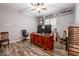 Home office features wood desk, chair, and built-in shelving at 28821 N Ashbrook Ln, Queen Creek, AZ 85144