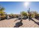 Charming patio with fountain, seating area, and desert landscaping at 28821 N Ashbrook Ln, Queen Creek, AZ 85144