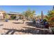 Spacious patio with pergola, seating, and lush landscaping at 28821 N Ashbrook Ln, Queen Creek, AZ 85144