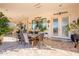 Covered patio with dining table and seating area at 28821 N Ashbrook Ln, Queen Creek, AZ 85144