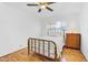 Simple bedroom with hardwood floors and ceiling fan at 303 W 9Th St, Mesa, AZ 85201