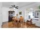 Dining area with wooden table, chairs, and a large window at 303 W 9Th St, Mesa, AZ 85201