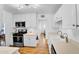 Clean and bright kitchen with white cabinets and stainless steel appliances at 303 W 9Th St, Mesa, AZ 85201