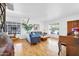 Living room with hardwood floors, a piano, and comfortable seating at 303 W 9Th St, Mesa, AZ 85201