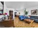 Living room with hardwood floors, a piano, and comfortable seating at 303 W 9Th St, Mesa, AZ 85201