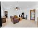 Cozy living room featuring a leather sofa, coffee table, and built-in shelving at 303 W 9Th St, Mesa, AZ 85201