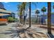 Outdoor public plaza with palm trees, shade structures, and modern architecture at 303 W 9Th St, Mesa, AZ 85201