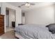 Main bedroom with ensuite bathroom and ceiling fan at 30905 W Fairmount Ave, Buckeye, AZ 85396