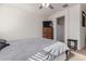 Main bedroom with dresser, tv, and ensuite bathroom at 30905 W Fairmount Ave, Buckeye, AZ 85396