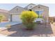 Landscaped front yard with drought-tolerant plants enhances the exterior of this beautiful home at 30905 W Fairmount Ave, Buckeye, AZ 85396