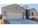 White garage door and neutral tones give this home great curb appeal at 30905 W Fairmount Ave, Buckeye, AZ 85396