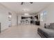 Modern kitchen with dark wood cabinets, granite countertops, and an island with seating at 30905 W Fairmount Ave, Buckeye, AZ 85396