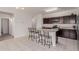 Kitchen with an island and dark wood cabinets at 30905 W Fairmount Ave, Buckeye, AZ 85396