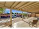 Covered patio overlooks a fun backyard with fire pit at 3101 W Topeka Dr, Phoenix, AZ 85027