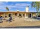 Covered patio with seating area and fire pit at 3101 W Topeka Dr, Phoenix, AZ 85027