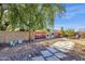 Landscaped backyard with stone pathway and seating area at 3101 W Topeka Dr, Phoenix, AZ 85027