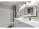 Charming bathroom with a white vanity and marble countertop at 3101 W Topeka Dr, Phoenix, AZ 85027