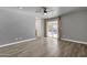 Bedroom with gray walls, hardwood floors and sliding door to patio at 3101 W Topeka Dr, Phoenix, AZ 85027