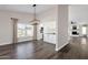 Bright dining room with hardwood floors and chandelier at 3101 W Topeka Dr, Phoenix, AZ 85027