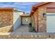 Front entry with brick walkway and mature plants at 3101 W Topeka Dr, Phoenix, AZ 85027